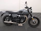 a motorcycle that is parked on a black and white checkered floor