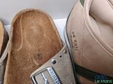 two pairs of slippers that are sitting on a box