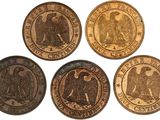 six different types of coins are shown on a white surface