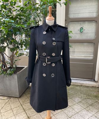the coat is black and has silver buttons on it