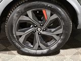 a close up of a tire on a car ' s rim