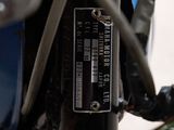 a close up of a motorcycle with wires attached to it