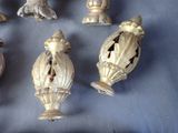 a lot of antique brass figurines sitting on a table