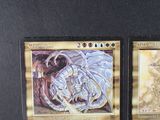 two cards that are sitting on a table