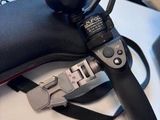 a video camera attached to the handle of a tripod