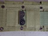 a close up of a belt with a knife in it