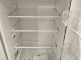 an open refrigerator with a lot of food inside of it