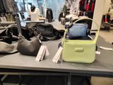 many bags on a table in a store