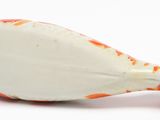 a white and orange bird figurine on a white surface