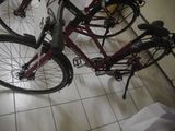 a red bike that is sitting on the floor