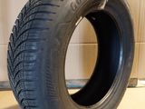 a close up of a tire on a stand in a room