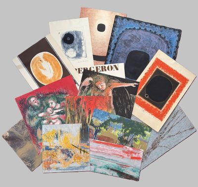 several cards of different colors and designs are arranged on a gray surface