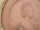 a picture of a picture of a woman and a child in a gold frame