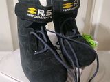a pair of shoes that are on top of a box