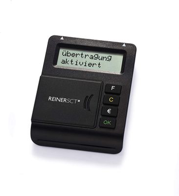 a calculator sitting on a white surface with a message on the display