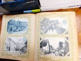an open book on a table with pictures on it