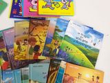 a lot of children ' s books on the table