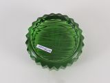 a green glass bottle with a sticker on it