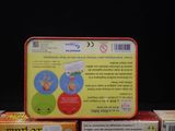 several children ' s books sitting on top of each other on a table