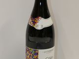 a bottle of wine that is sitting on a table