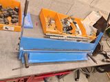 some tools are sitting on a table in a room