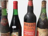 several bottles of wine are lined up on a table