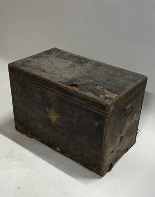 an old wooden box sitting on a white surface
