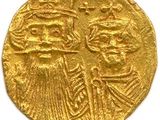 une pièce d'or sur laquelle figurent un homme et une femme
