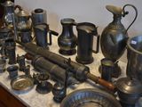 a lot of silver items that are on a table