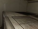 a metal grate in the middle of the floor of a truck