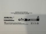 the back of a white box with a black label on it