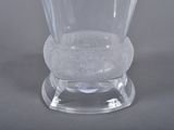a clear glass vase sitting on top of a table