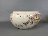 a white bowl with a floral design on it