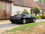 a black sports car parked on the side of the road