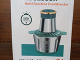 packaging of a multi function food blender sitting on a wooden table