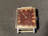 a small watch that is sitting on a table