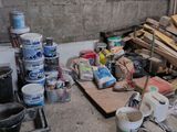 a pile of wood and paint on the floor in a room
