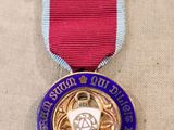 an image of a medal with a ribbon around it on a table