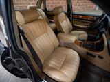 beige leather seats in a car with a brick wall in the background