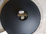 a picture of a black round object on a table