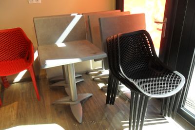 two chairs and a table in the corner of a room