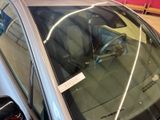 an image of a car that has a sticker on the windshield