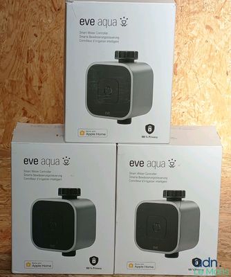 three boxes of the new products are sitting on a wooden surface