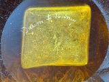 a glass plate with a picture on it sitting on a table