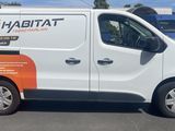 a white van that is parked in a parking lot
