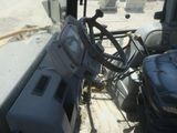 a view of the driver ' s seat from inside a truck