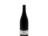 a bottle of wine that is sitting on a table