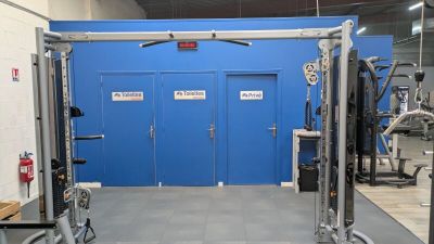 an image of a gym room with equipment in it