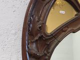 a mirror that is hanging on the wall in the room