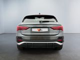 the rear end of a grey audi v - pace